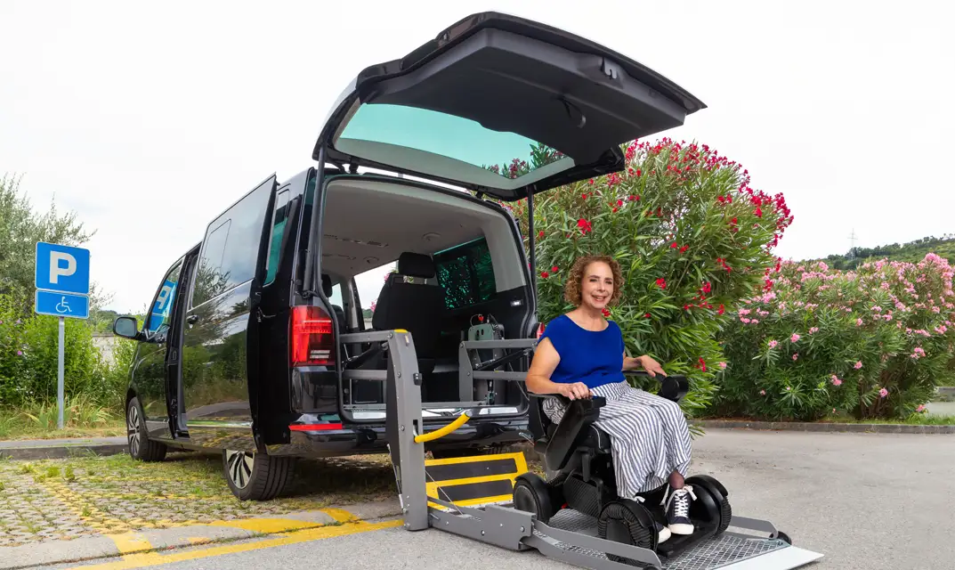 Patient in wheelchair deboarding a van